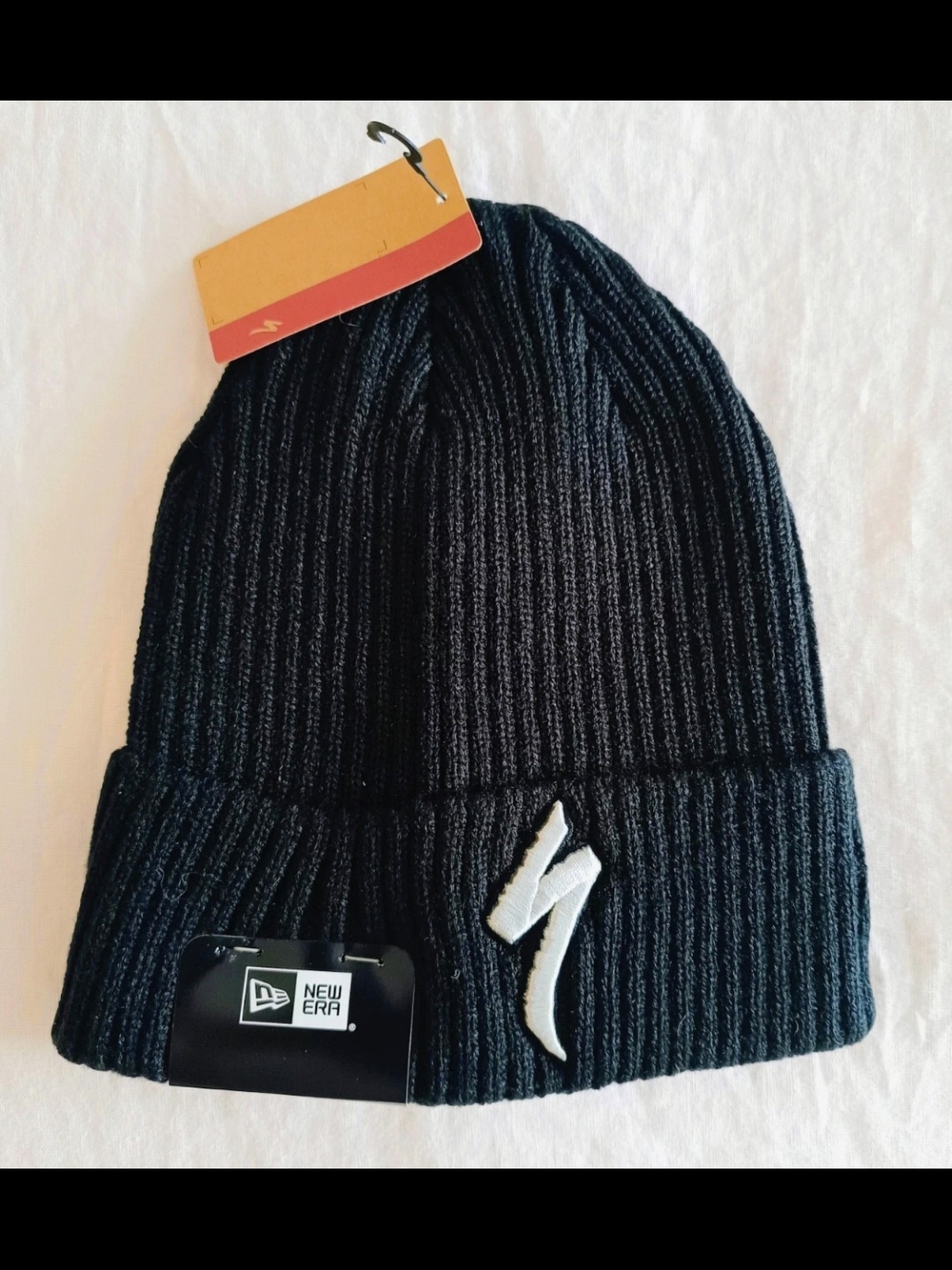 New Era Black Ribbed Beanie with White Logo Patch
